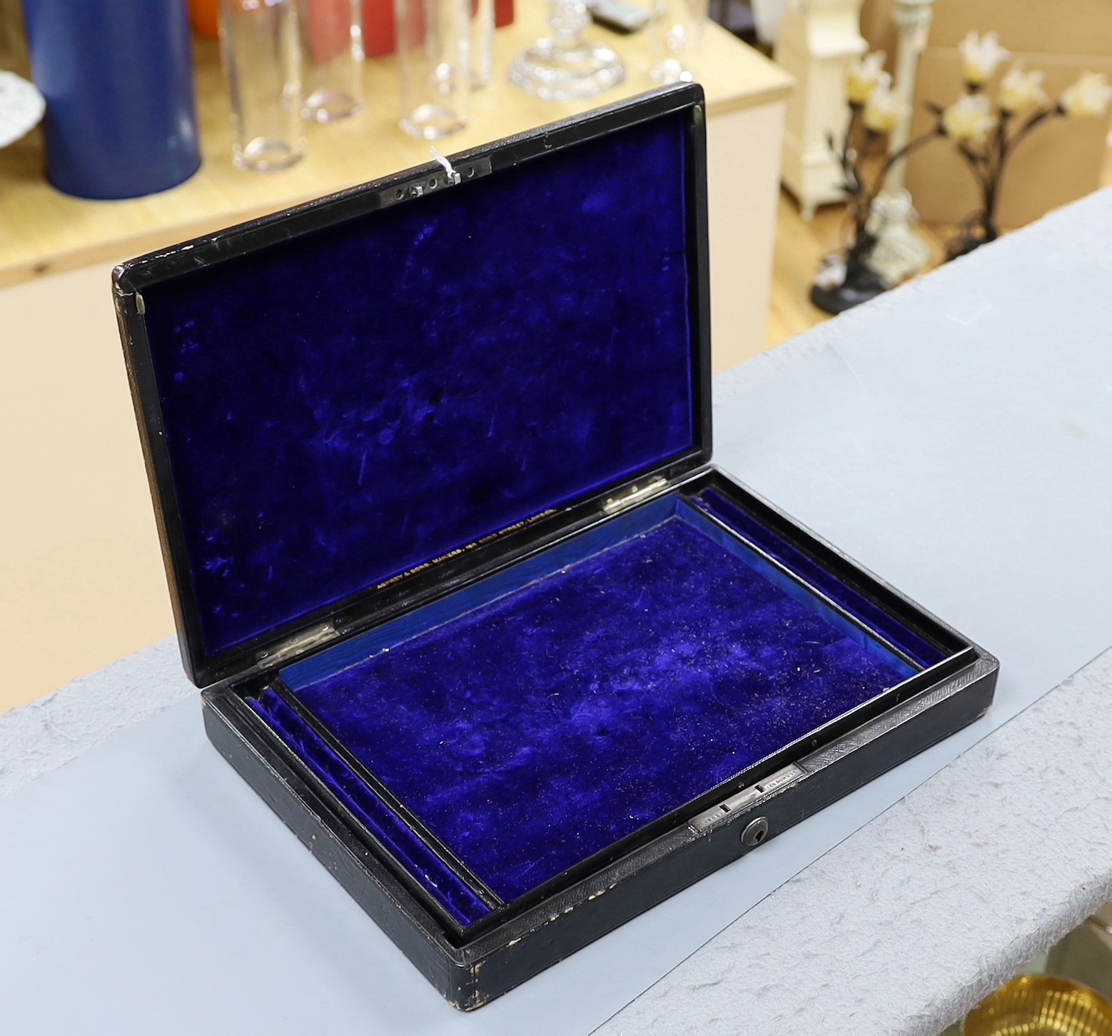 An Asprey & Co. Morocco leather jewellery box, with applied white metal monogram, 33.2cm width